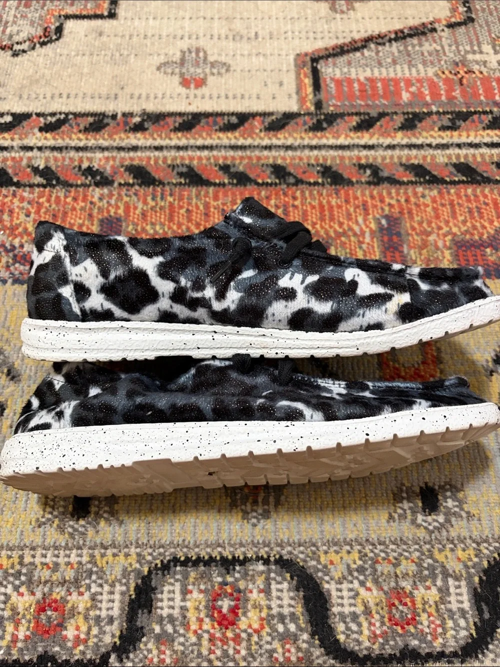 Gypsy Jazz Black & White Cow Print Slip-On Sneakers